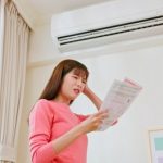 Economic,inflation,concept, ,asian,woman,stand,by,air,conditioner
