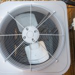 Top,view,of,residential,air,conditioning,unit,outdoors,with,fan