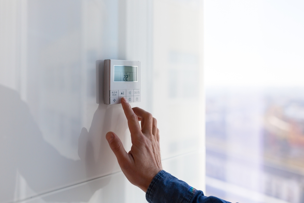 The,air,conditioning,and,heating,control,panel,for,the,apartment